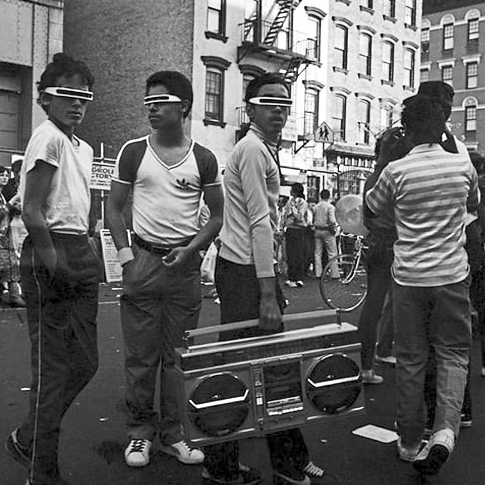 A young hip hop group in shades